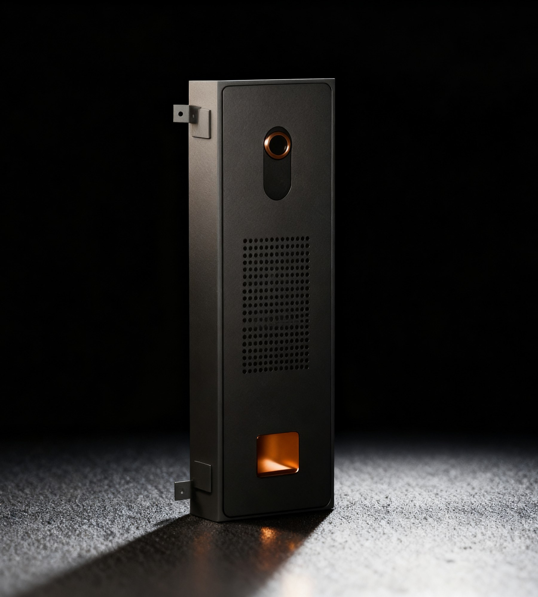 Koja's Tech Bar: a charcoal module with a bronze-ringed camera, speaker grille and bronze treat cup